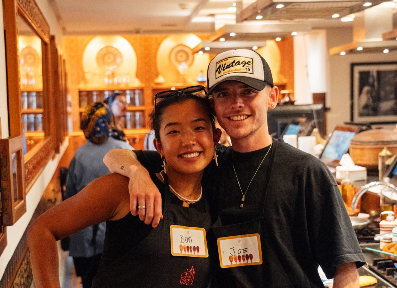 Two young travellers pose during their time in a cooking class in Marrakech on day 8 of their group tour in Morocco