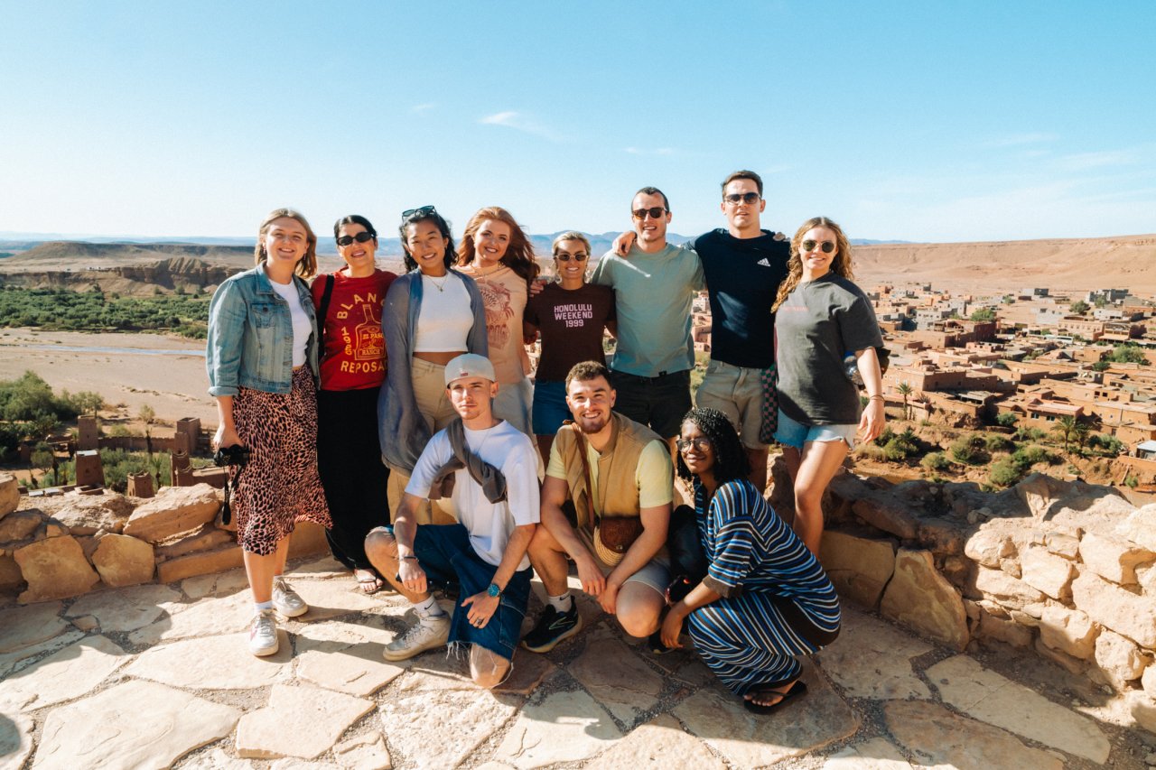 Group of solo travellers at A&iuml;t Benhaddou kasbar in Morocco on a organised adventure with TruTravels